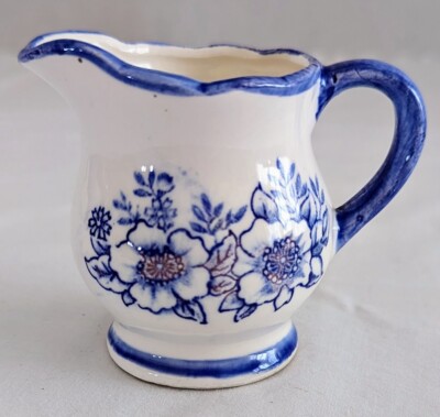 Vintage Enesco Imports mini pitcher, white with blue floral design and trim.-image