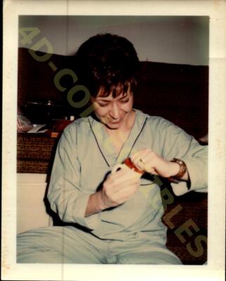 Vintage Snapshot Photograph  Unwrapping Memories in Cozy Comfort-image